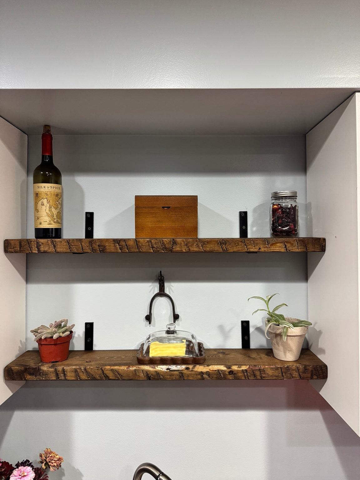Dark walnut floating shelves close up showing wood grain texture